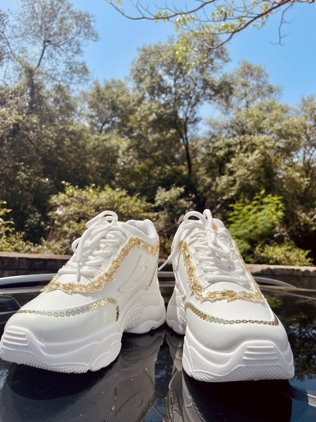 White and store gold designer sneakers